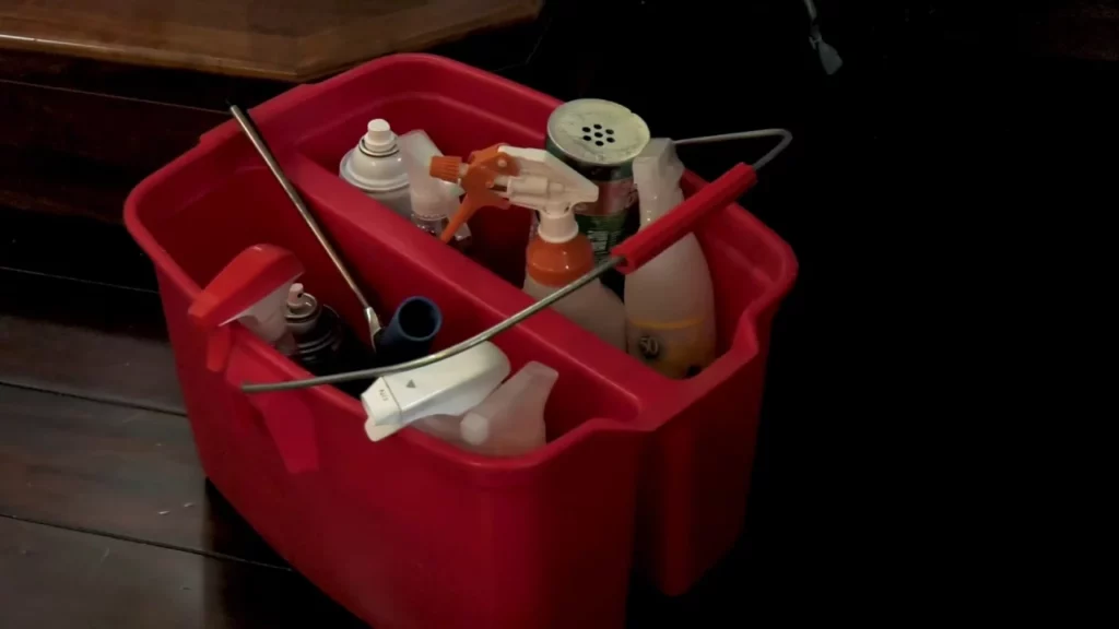 - Housecall Pro home cleaning supplies in red bucket for maid service business