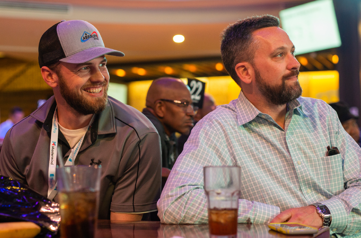 - Housecall Pro Two pros sitting together at a conference