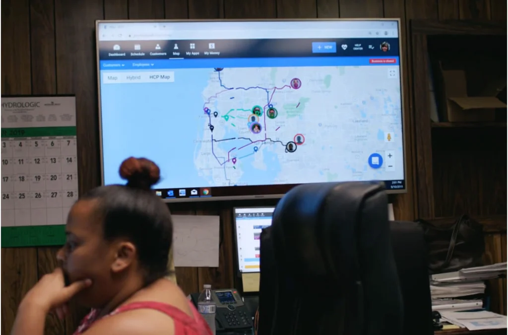 - Housecall Pro TV screen with live real time map and GPS routes