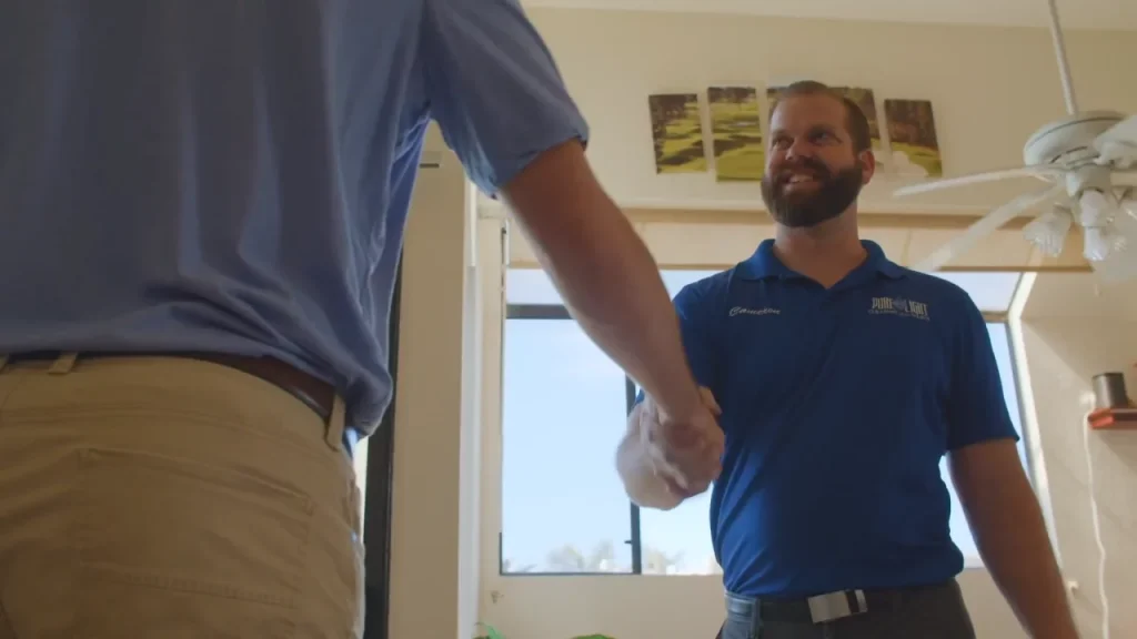 - Housecall Pro Pro smiling shaking customers hand