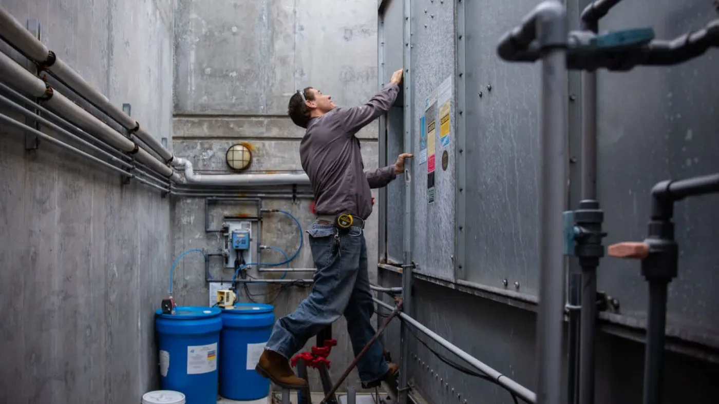 - Housecall Pro hvac technician working on a machine
