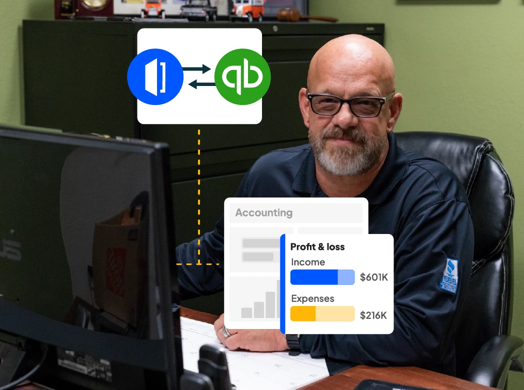 HVAC pro sits at office desk