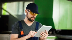 Electrician using a tablet at work.